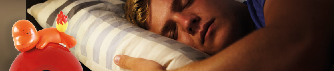 Close Up Of Teenage Boy Asleep In Bed At Night
